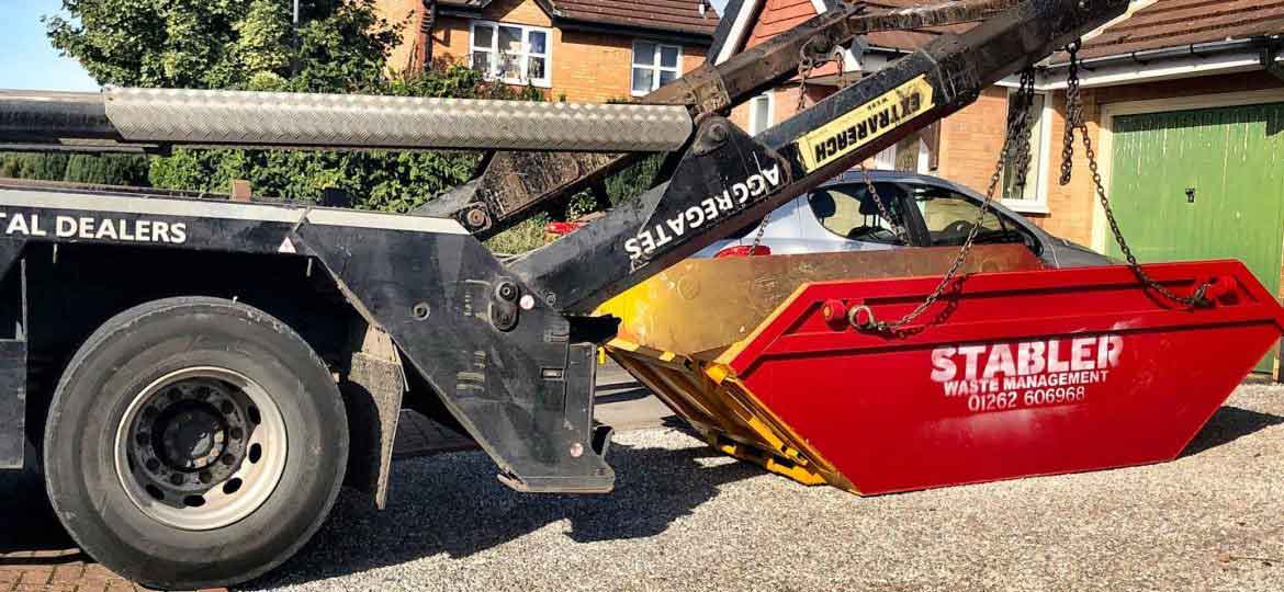 Stabler waste skip being delivered to a residential driveway in Yorkshire